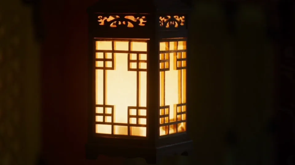 A paper lantern in a palace corridor