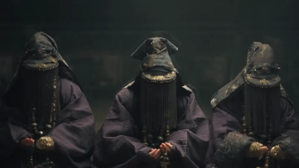 Veiled figures at prayer